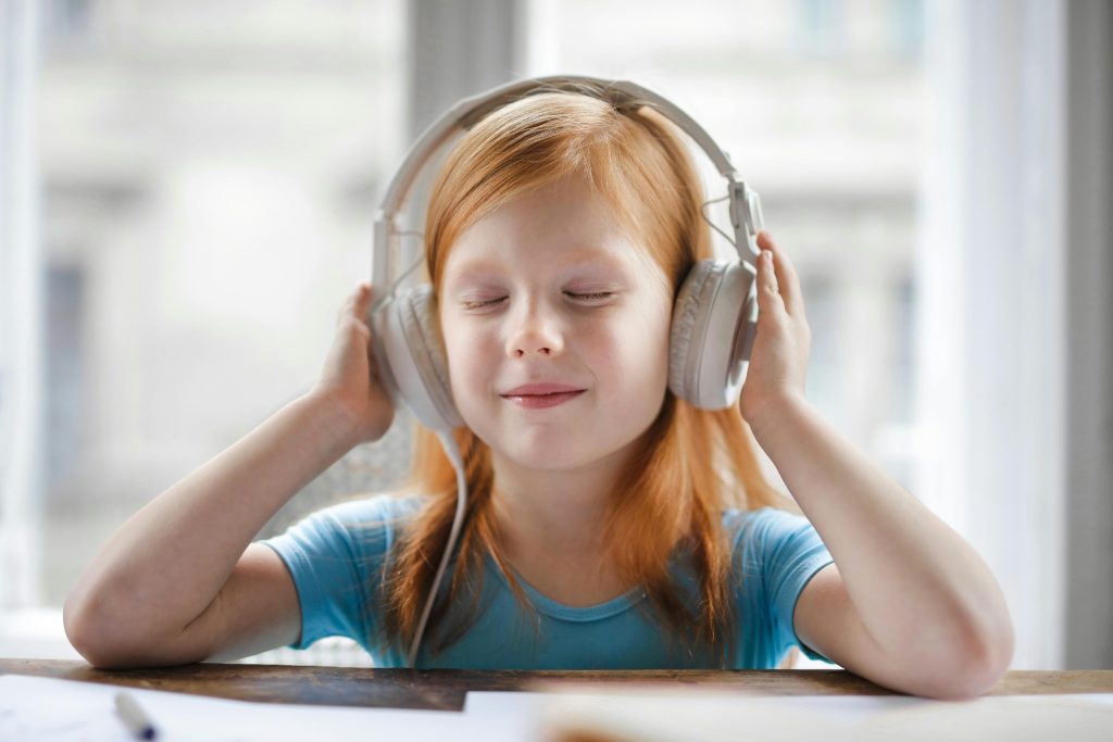 Child wearing headphones for sensory support in Autism Advocacy in Public Spaces
