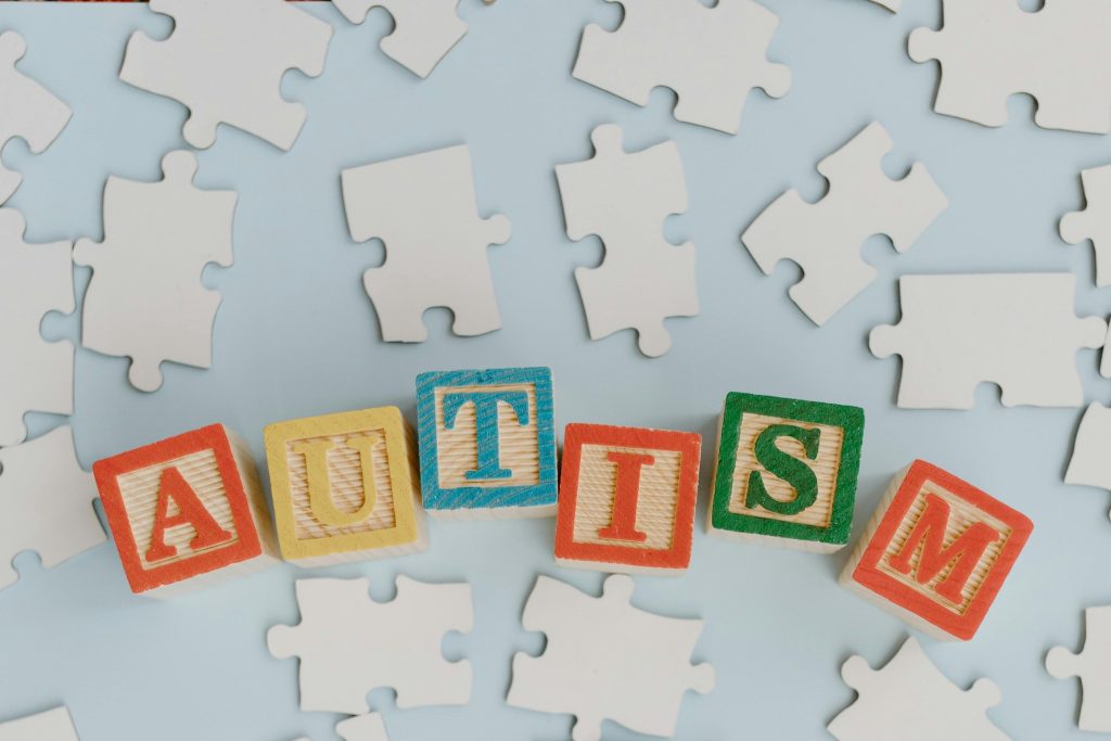 Puzzle pieces and autism blocks symbolizing Autism Advocacy in Public Spaces