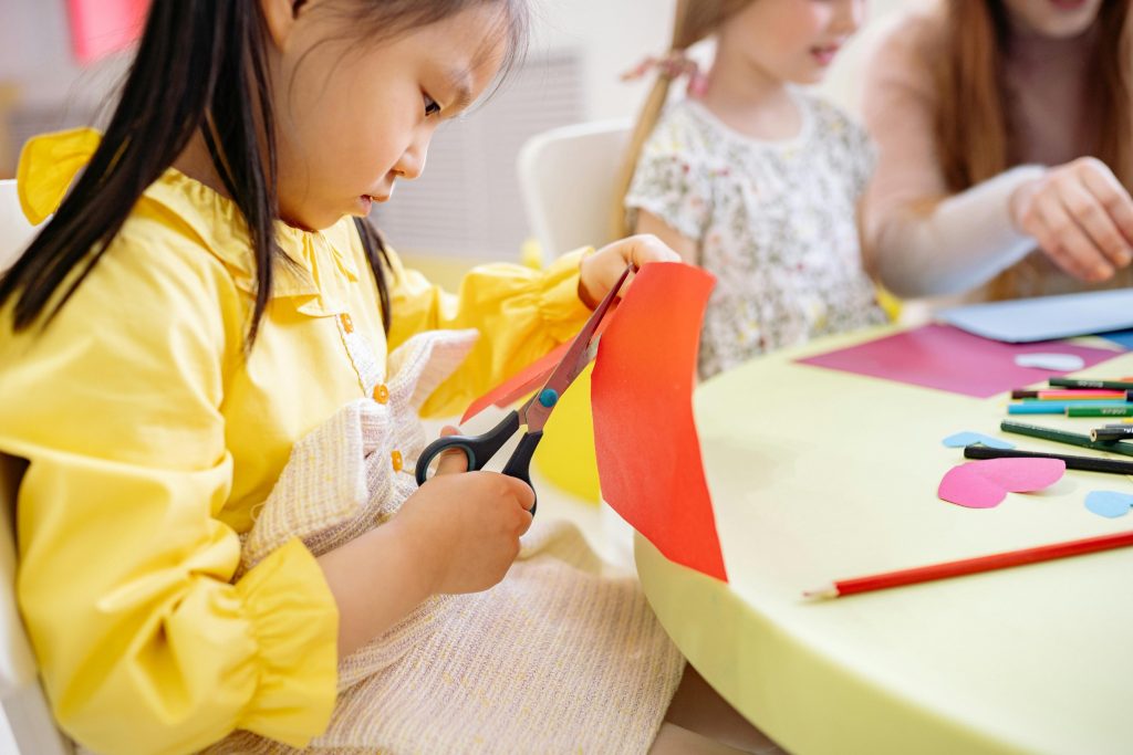 Child practicing skills with positive reinforcement autism activity