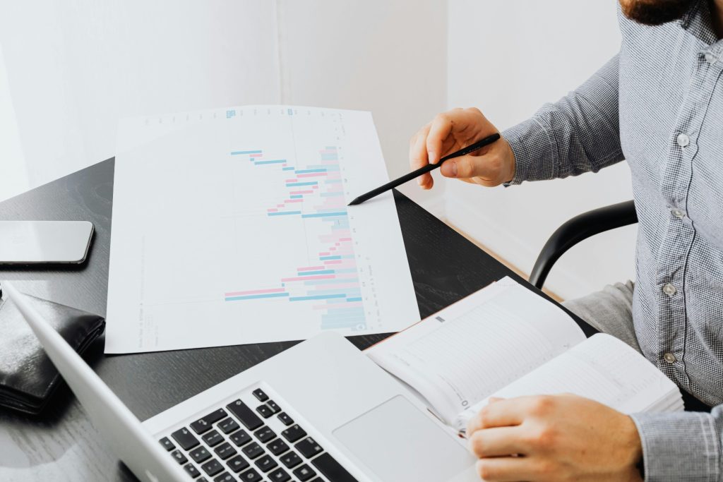 Data charts and notebook representing applied behavior analysis statistics for tracking therapy outcomes and trends