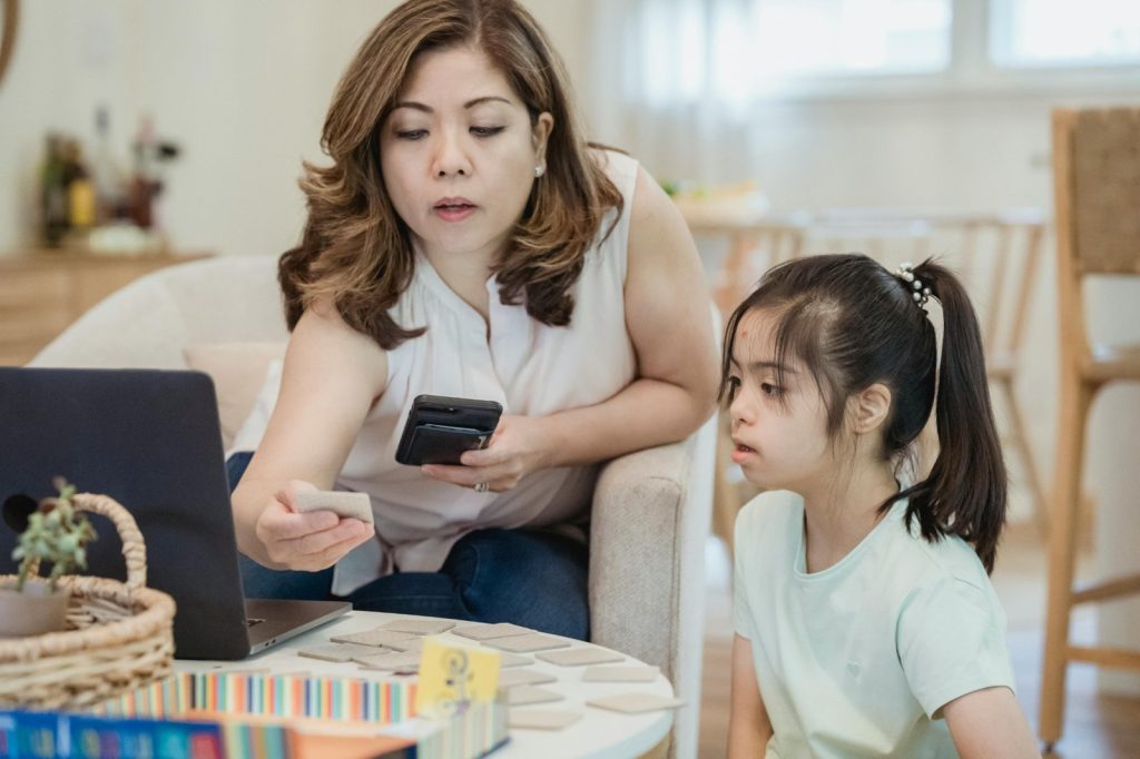 Parent guiding stress management for kids through interactive learning activities