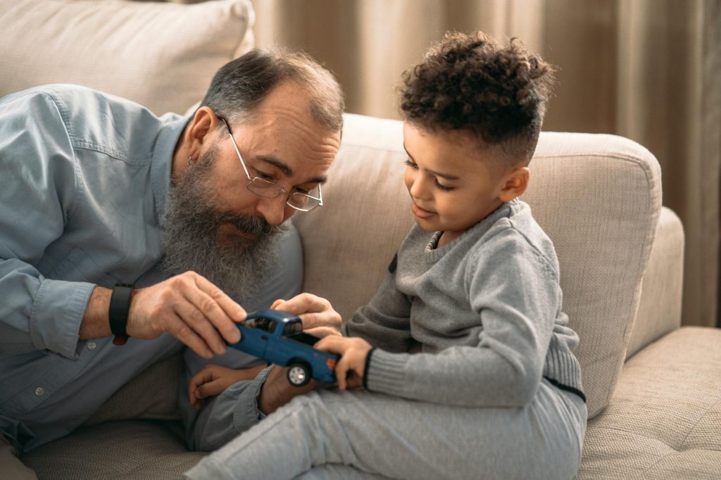 Therapist supporting a child during developmental therapy, illustrating ABA therapy and insurance coverage in 2025